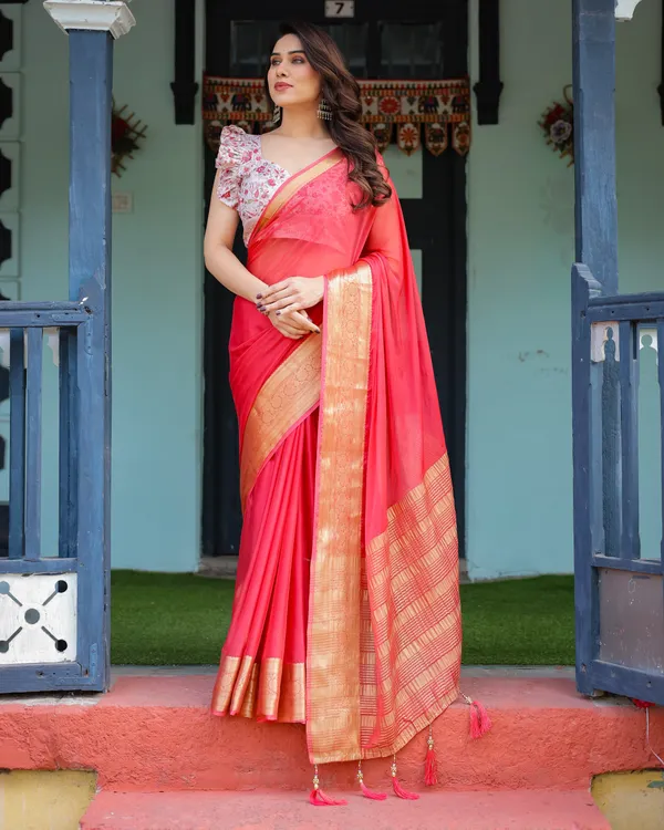 Vibrant_Coral_Pink_Plain_Chiffon_Saree_with_Gold_Zari_Border,_Floral_Ruffled_Blouse_&_Tassel_Detailing