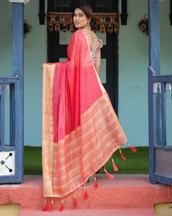 Vibrant_Coral_Pink_Plain_Chiffon_Saree_with_Gold_Zari_Border,_Floral_Ruffled_Blouse_&_Tassel_Detailing