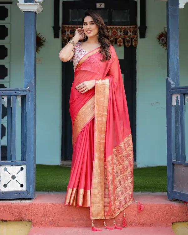 Vibrant_Coral_Pink_Plain_Chiffon_Saree_with_Gold_Zari_Border,_Floral_Ruffled_Blouse_&_Tassel_Detailing