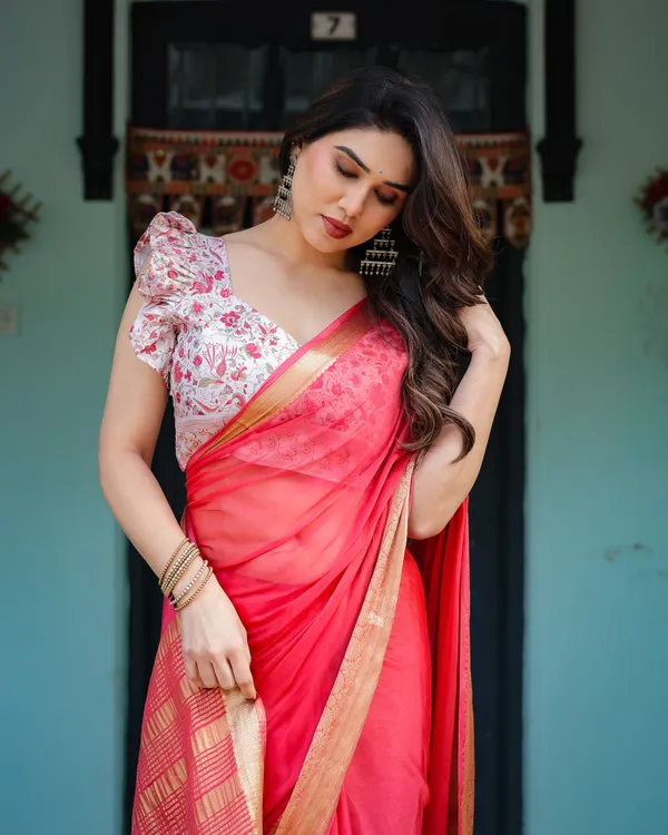 Vibrant_Coral_Pink_Plain_Chiffon_Saree_with_Gold_Zari_Border,_Floral_Ruffled_Blouse_&_Tassel_Detailing