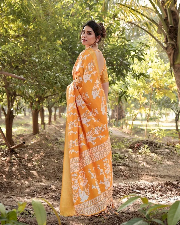 Sunshine_Yellow_Tussar_Silk_Saree_with_White_Floral_Motifs,_Lustrous_Zari_Border,_and_Graceful_Tassel_Pallu