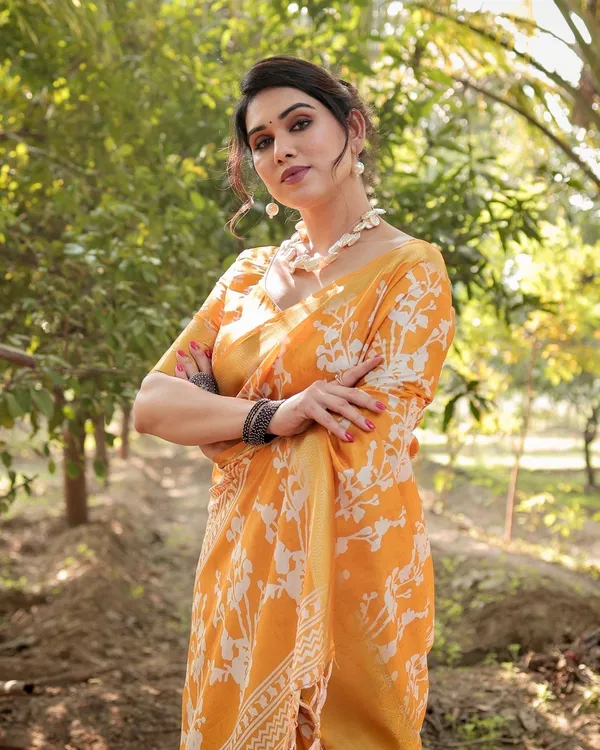 Sunshine_Yellow_Tussar_Silk_Saree_with_White_Floral_Motifs,_Lustrous_Zari_Border,_and_Graceful_Tassel_Pallu