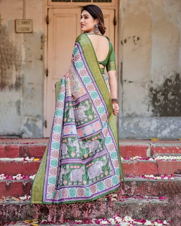 Ivory_and_Green_Tussar_Silk_Saree_with_Elephant_Motifs_and_Intricate_Zari_Border
