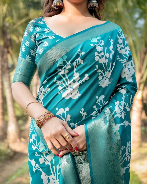 Teal_Blue_Tussar_Silk_Saree_with_White_Floral_Design,_Gold_Zari_Border_&_Tassel_Pallu