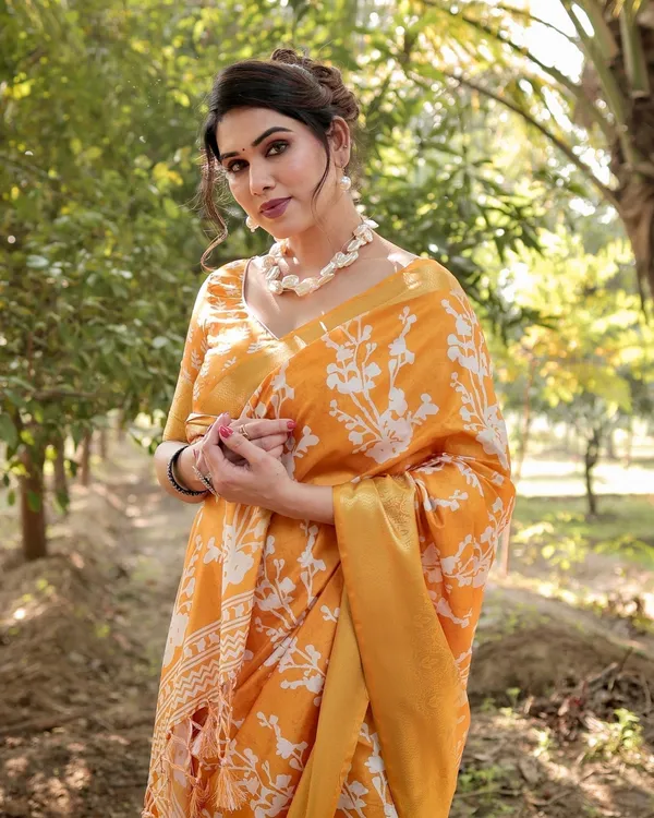 Sunshine_Yellow_Tussar_Silk_Saree_with_White_Floral_Motifs,_Lustrous_Zari_Border,_and_Graceful_Tassel_Pallu