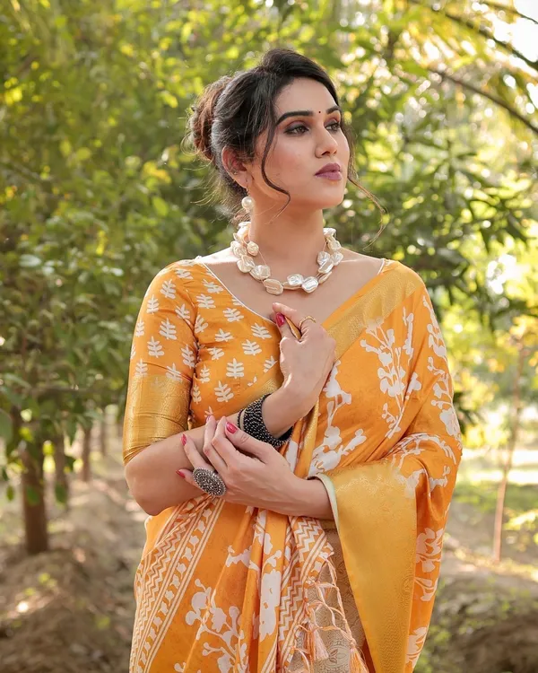 Sunshine_Yellow_Tussar_Silk_Saree_with_White_Floral_Motifs,_Lustrous_Zari_Border,_and_Graceful_Tassel_Pallu