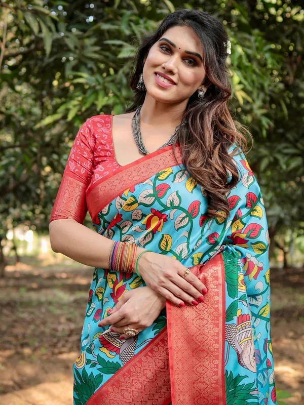 Aqua_Blue_Tussar_Silk_Saree_with_Vibrant_Nature-Inspired_Prints_and_Red_Zari_Border