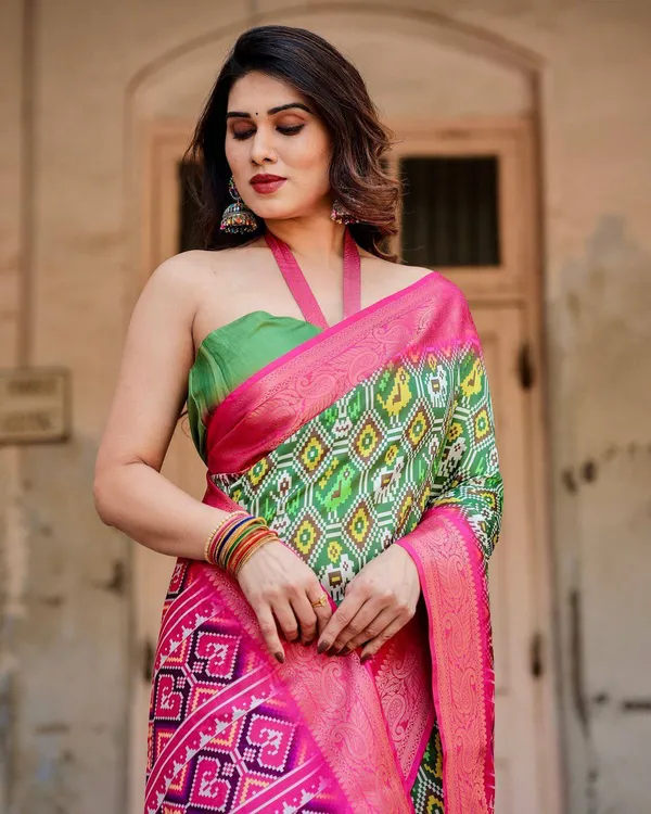Green_and_Pink_Tussar_Silk_Saree_with_Vibrant_Ikat_Patterns_and_Zari_Border