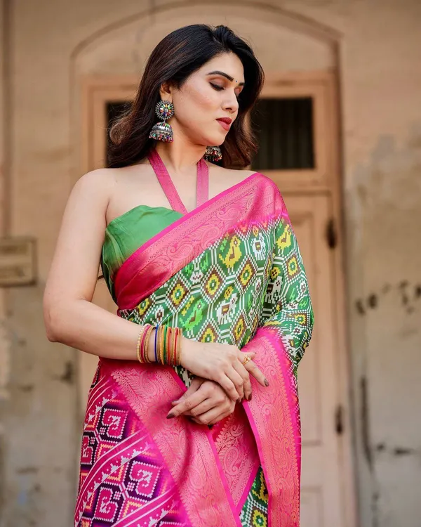 Green_and_Pink_Tussar_Silk_Saree_with_Vibrant_Ikat_Patterns_and_Zari_Border