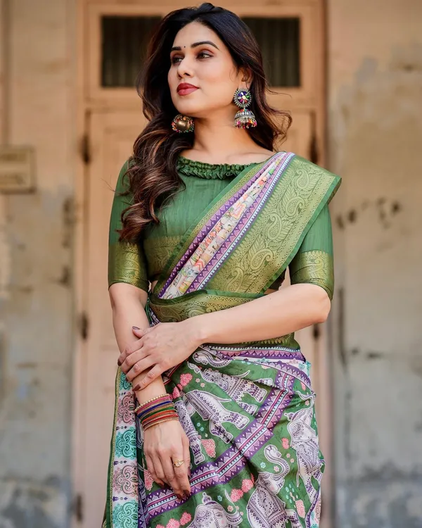 Ivory_and_Green_Tussar_Silk_Saree_with_Elephant_Motifs_and_Intricate_Zari_Border