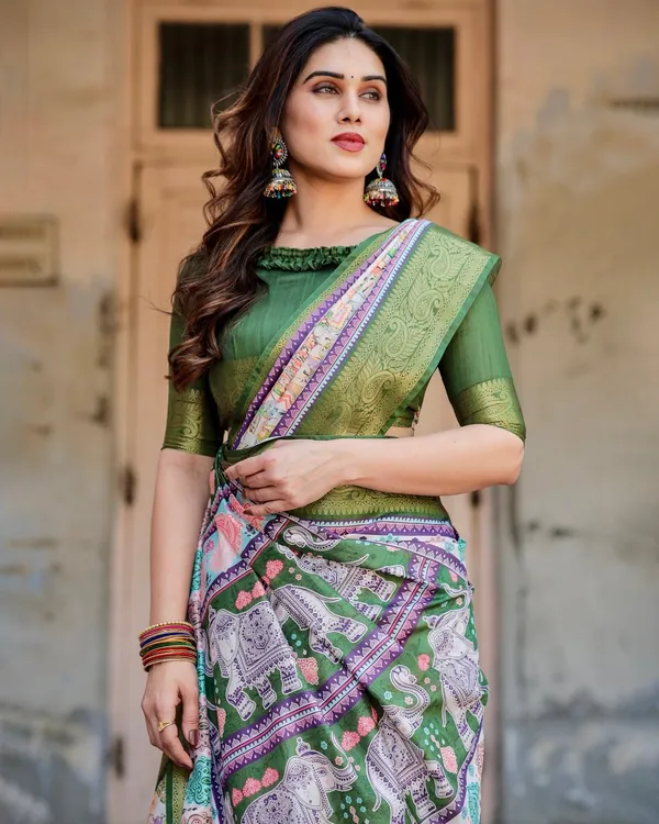 Ivory_and_Green_Tussar_Silk_Saree_with_Elephant_Motifs_and_Intricate_Zari_Border