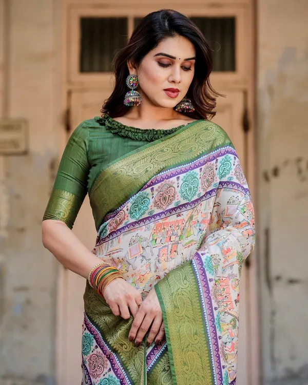 Ivory_and_Green_Tussar_Silk_Saree_with_Elephant_Motifs_and_Intricate_Zari_Border