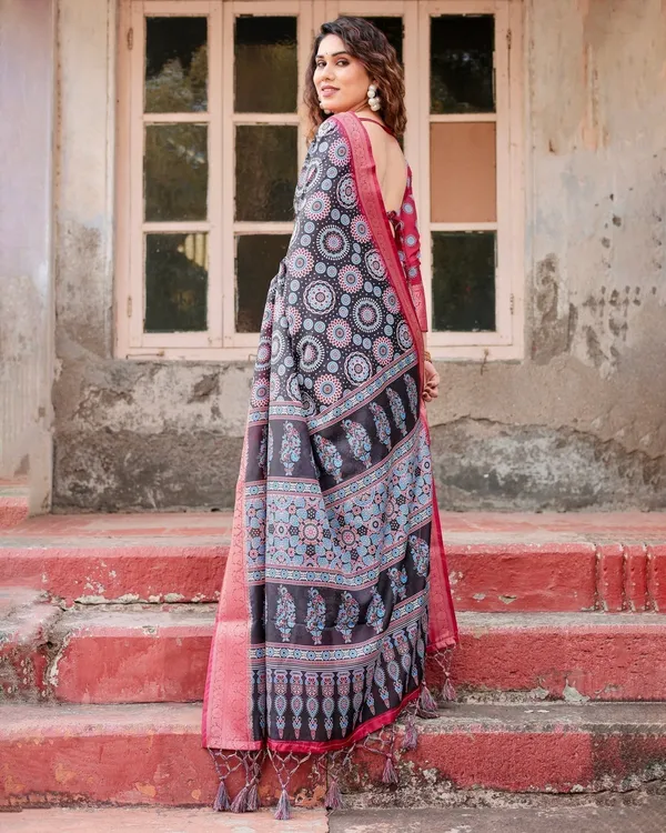 Black_and_Coral_Tussar_Silk_Saree_with_Intricate_Circular_Motifs_and_Ornamental_Pallu