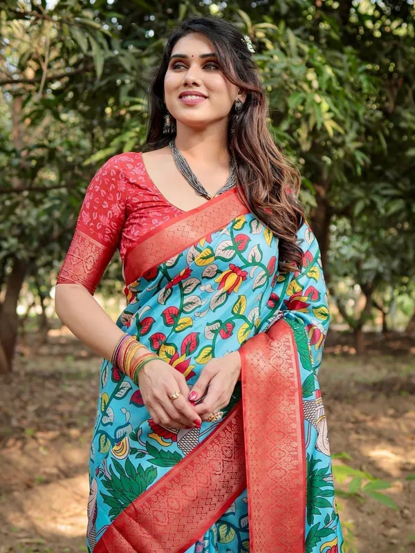 Aqua_Blue_Tussar_Silk_Saree_with_Vibrant_Nature-Inspired_Prints_and_Red_Zari_Border