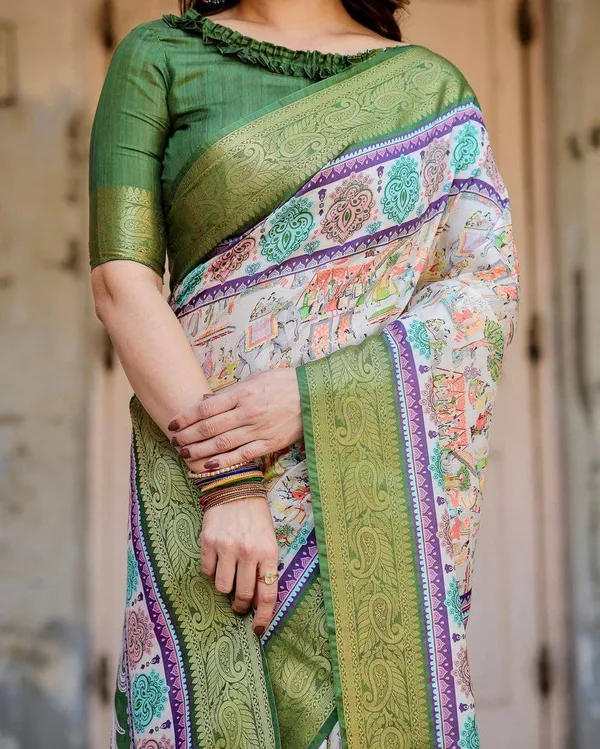 Ivory_and_Green_Tussar_Silk_Saree_with_Elephant_Motifs_and_Intricate_Zari_Border