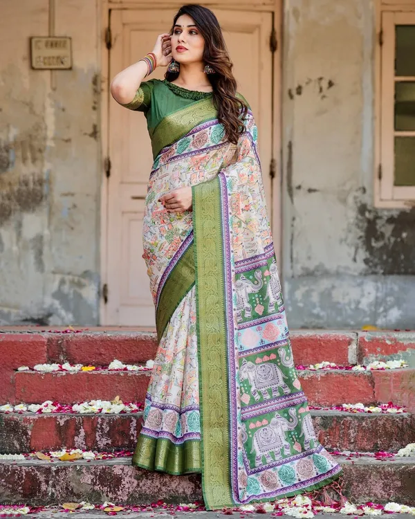 Ivory_and_Green_Tussar_Silk_Saree_with_Elephant_Motifs_and_Intricate_Zari_Border