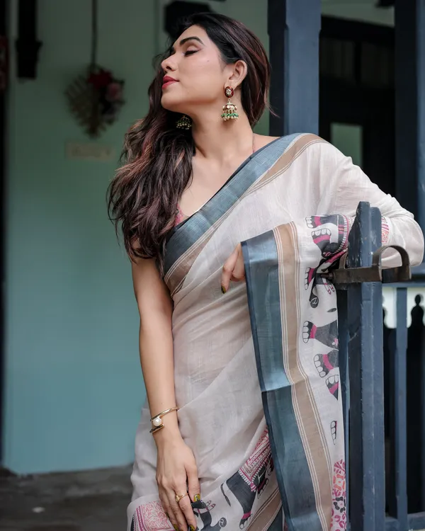 Ivory_Pure_Cotton_Linen_Saree_with_Elephant_Motif_and_Tassel_Detailing