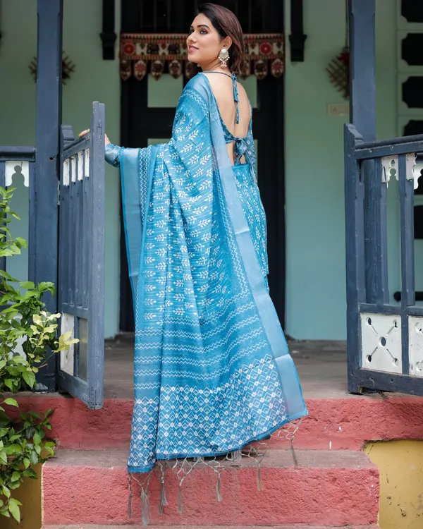 Turquoise_Pure_Cotton_Linen_Saree_with_White_Floral_Design,_Blouse,_and_Tassel_Edges