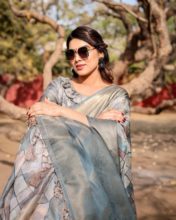 Elegant_Pastel_Blue_Banarasi_Silk_Saree_with_Intricate_Geometric_Design_and_Zari_Work_Tassel_Pallu