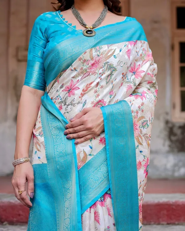 White_and_Aqua_Floral_Design_Banarasi_Silk_Saree_with_Zari_Weave_and_Tassel-Embellished_Pallu