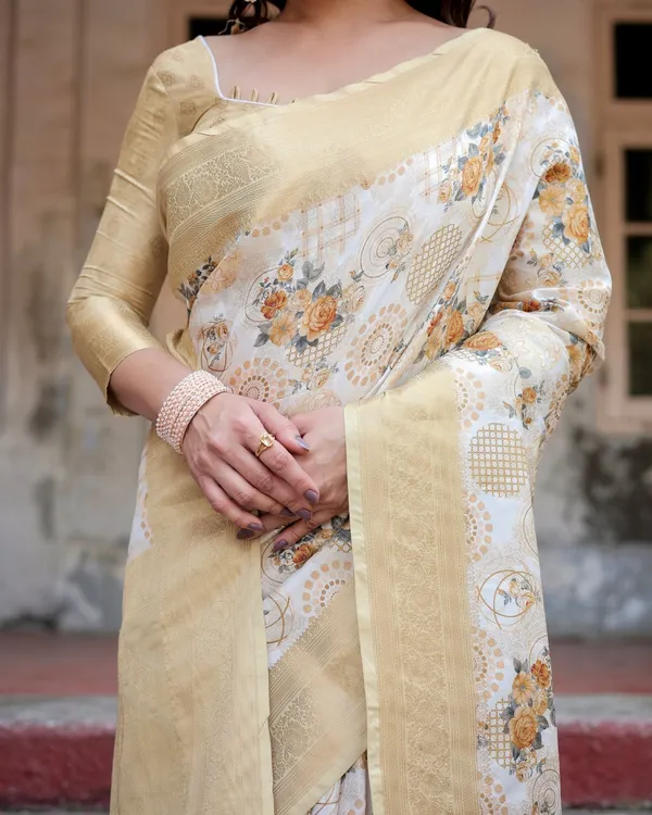 Ivory_and_Gold_Banarasi_Silk_Saree_with_Floral_Print,_Zari_Border,_and_Tassels