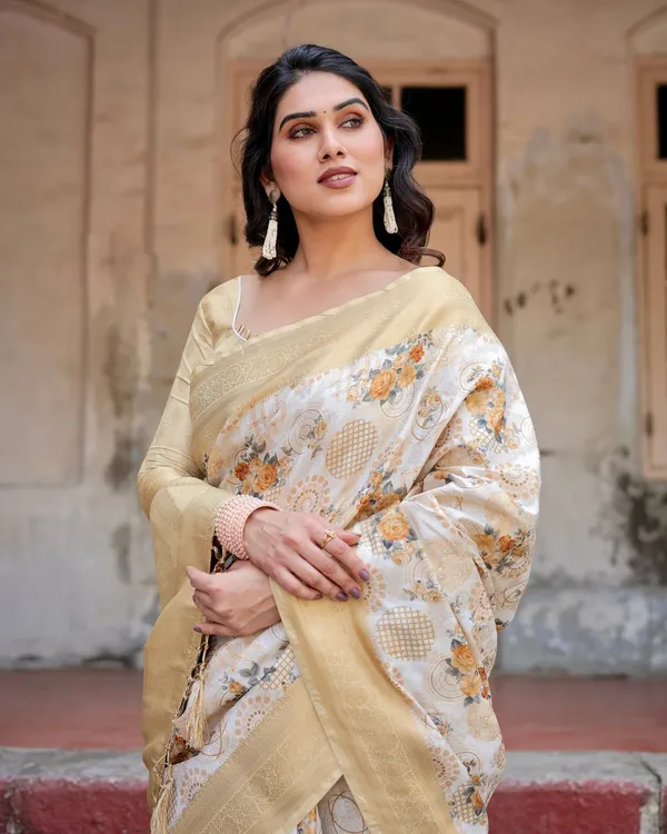 Ivory_and_Gold_Banarasi_Silk_Saree_with_Floral_Print,_Zari_Border,_and_Tassels