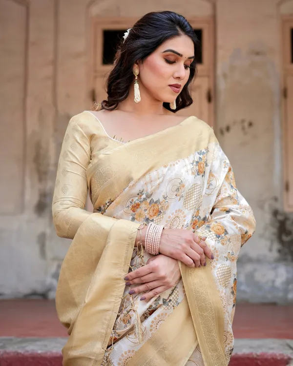 Ivory_and_Gold_Banarasi_Silk_Saree_with_Floral_Print,_Zari_Border,_and_Tassels