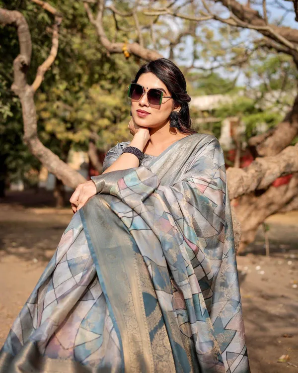 Elegant_Pastel_Blue_Banarasi_Silk_Saree_with_Intricate_Geometric_Design_and_Zari_Work_Tassel_Pallu