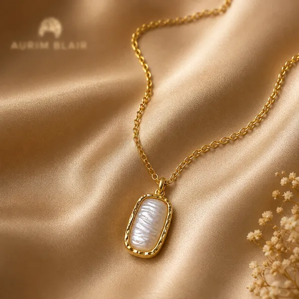 BAROQUE_PEARL_HAMMERED_PENDANT_NECKLACE
