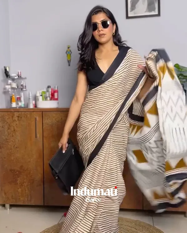 Ivory_Ink_-_Cream_Linen_Saree_with_Lining_Pattern,_Black_Border_&_Blouse