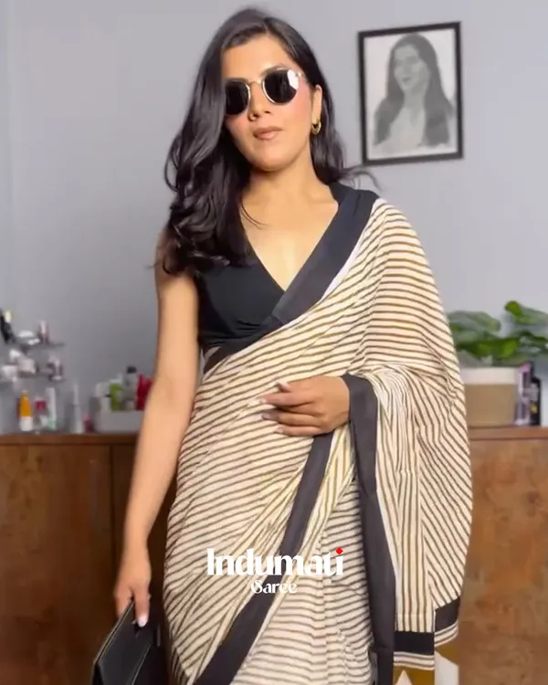 Ivory_Ink_-_Cream_Linen_Saree_with_Lining_Pattern,_Black_Border_&_Blouse