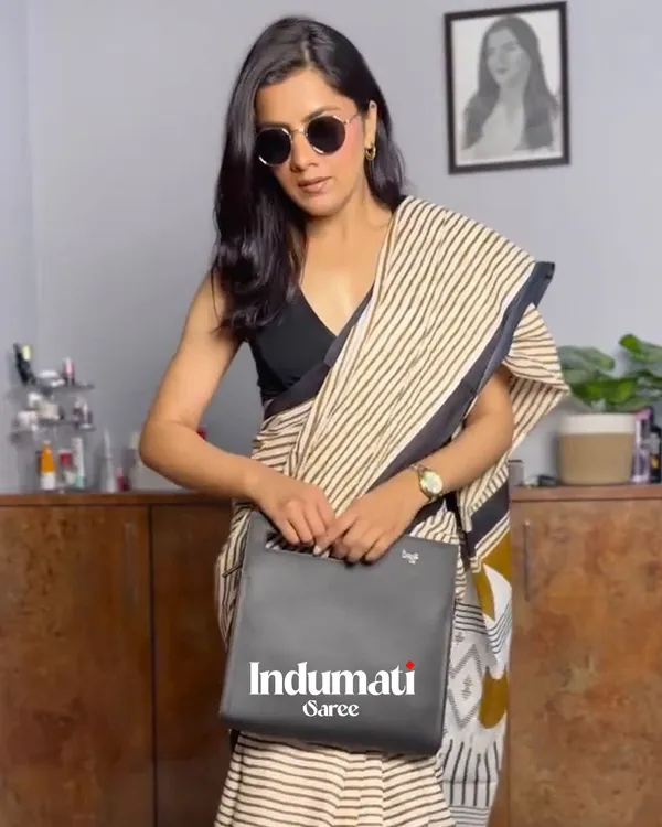 Ivory_Ink_-_Cream_Linen_Saree_with_Lining_Pattern,_Black_Border_&_Blouse