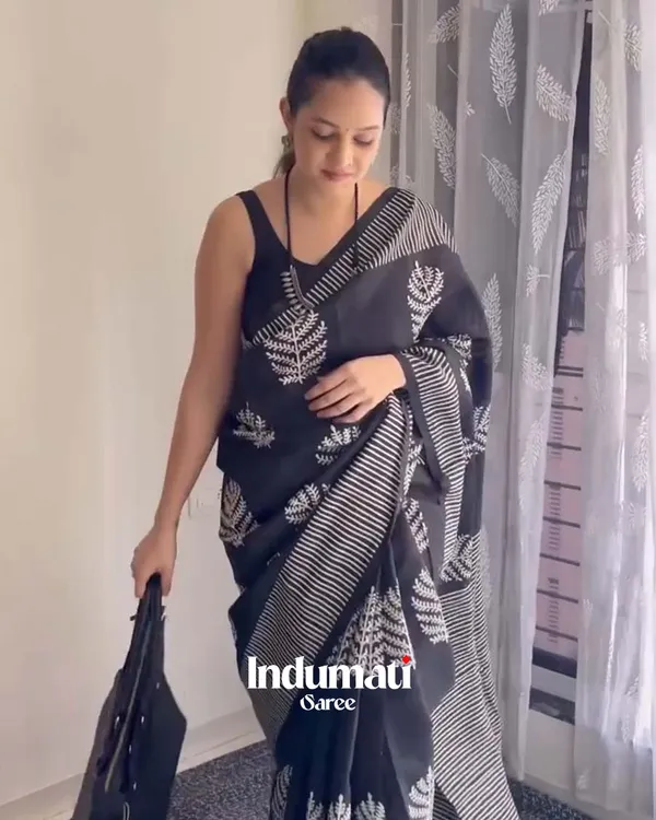 Shadow_Petals_-_Black_Linen_Saree_with_Black_Blouse_and_Floral_Accent