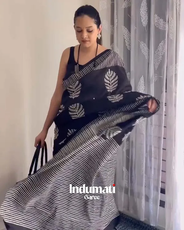 Shadow_Petals_-_Black_Linen_Saree_with_Black_Blouse_and_Floral_Accent