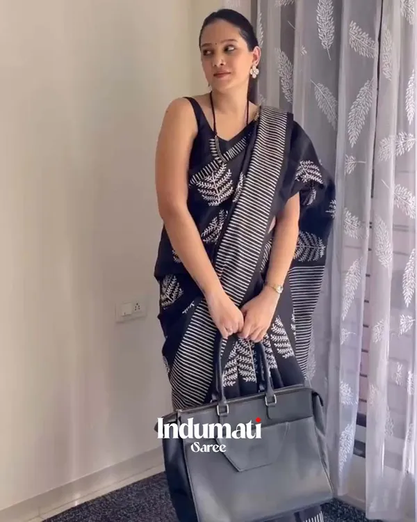 Shadow_Petals_-_Black_Linen_Saree_with_Black_Blouse_and_Floral_Accent