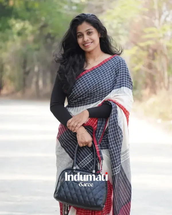 Ragini_Mala_-_Graceful_Black-White-Red_Linen_Saree_with_Subtle_Red_Border_&_Blouse_Piece