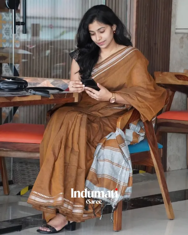 Tejas_Dhara_-_Saffron_Linen_Saree_with_Silver_Border_Design_&_Blouse_Piece