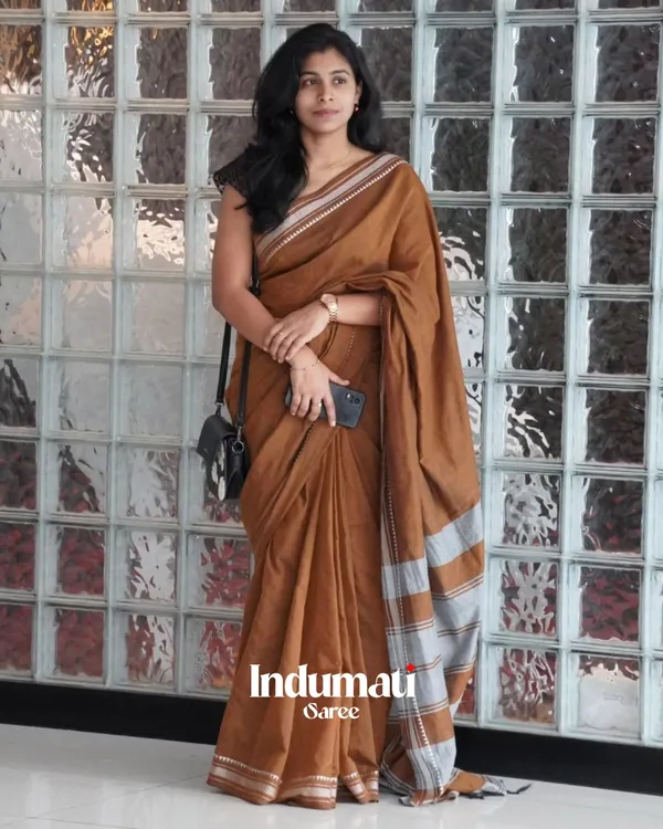 Tejas_Dhara_-_Saffron_Linen_Saree_with_Silver_Border_Design_&_Blouse_Piece