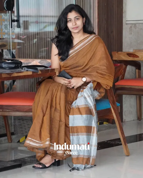 Tejas_Dhara_-_Saffron_Linen_Saree_with_Silver_Border_Design_&_Blouse_Piece