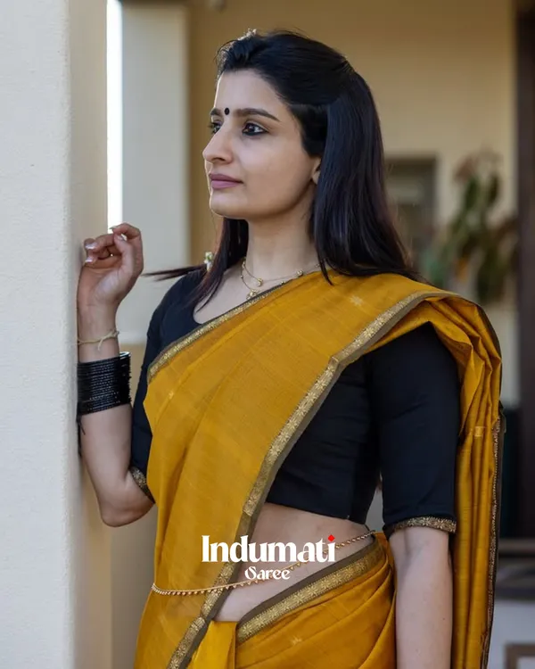 Mustard_Yellow_And_Black_Premium_Cotton_Silk_Saree_With_Classy_Blouse_and_tassels
