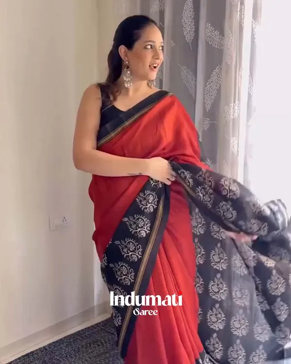 Red_Eclipse_-_Red_Linen_Saree_with_Black_Blouse_and_Black_Border