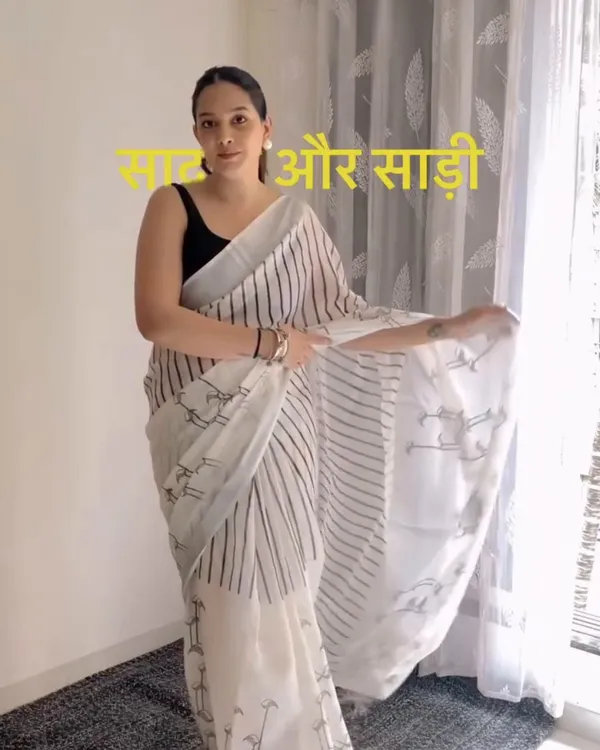 Hamsini_-_Graceful_White_Linen_Saree_with_Black_Border_Design_&_Blouse_Piece