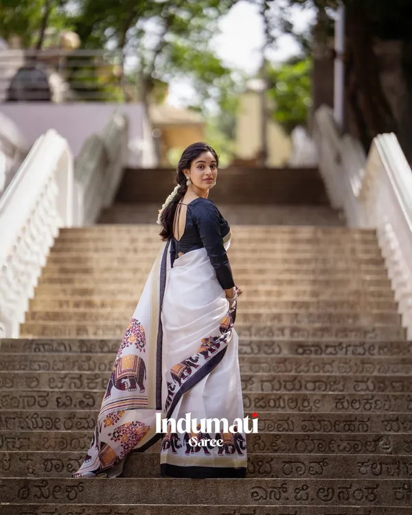 Shweta_Gaj_-_Classic_White_Linen_Saree_with_Elephant_Motif_Border_&_Blouse_Piece