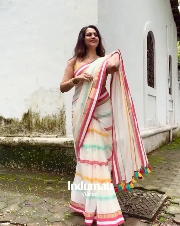 Pratham_Jyot_-_Pure_White_Linen_Saree_with_Vibrant_Multicolor_Stripe_Border_&_Blouse_Piece