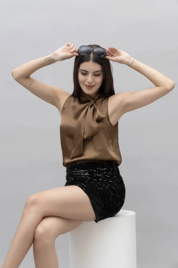 Brown_Satin_Tie-Up_Solid_Sleeveless_Hip_Length_Blouson_Top_For_Women
