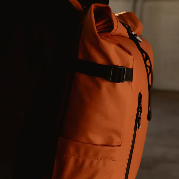 Sleek_16.5L_Waterproof_Backpack_For_Laptops_+_Luggage_Strap_Stale_Orange_For_Unisex
