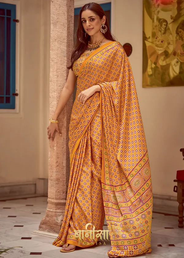 Orangish_Yellow_Ajrakh_Printed_Satin_Crepe_Saree_With_Matched_Unsttiched_Blouse