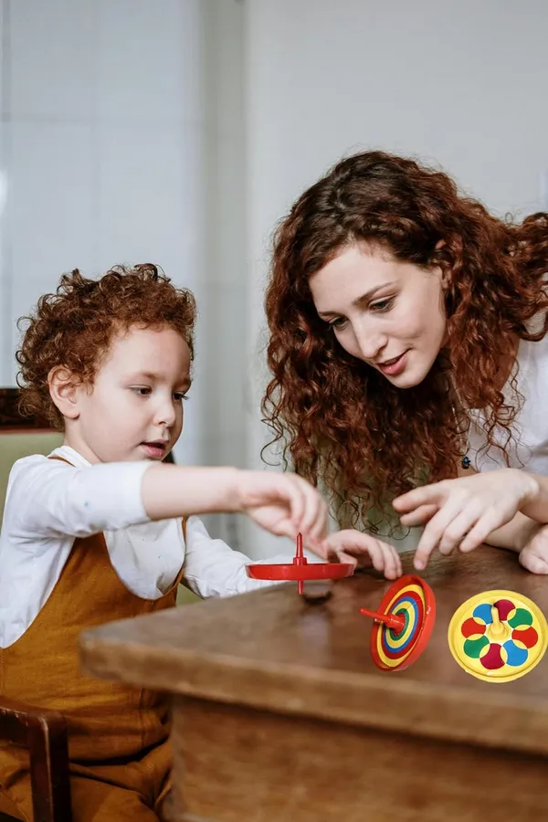 ‎Multicolor_Plastic_Spinning_Top_Toys_For_Kids_(Pack_Of_12)_(50_X_50_X_30_Mm)