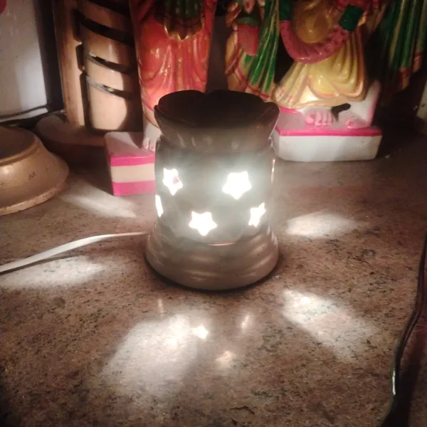 Ceramic_Electric_Aroma_Oil_Diffuser_with_Star_Cut_Design_–_Includes_10ml_Lavender_Fragrance_Oil