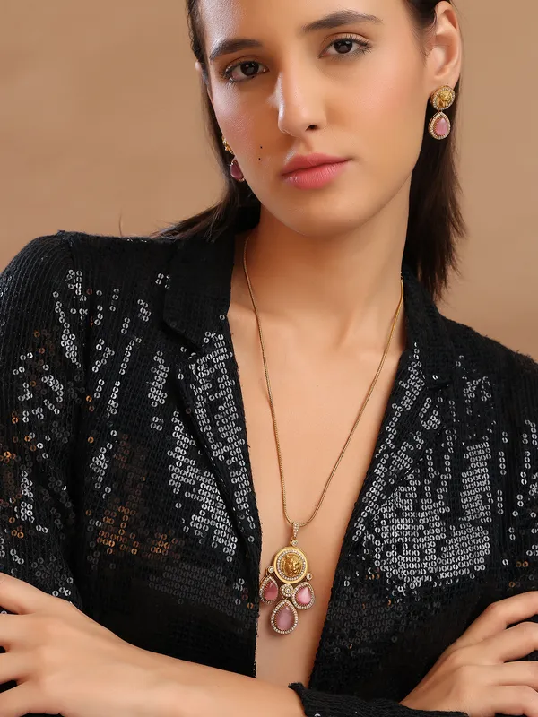 Stunning_Gold_Plated_Pendant_Set._The_top_charm_mirrors_the_gold_coin-like_emblem_With_Pink_stone.These_earrings_have_a_royal,_statement_appeal,_suitable_for_festive_or_formal_occasions.